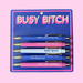Fun Club Busy Bitch pen set with 5 black ink ballpoint novelty pens featuring funny bold phrases on bright blue and pink packaging