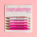 Fun Club Complimentary Pen Set with 5 pink black ink ballpoint pens featuring uplifting compliment phrases on display card packaging