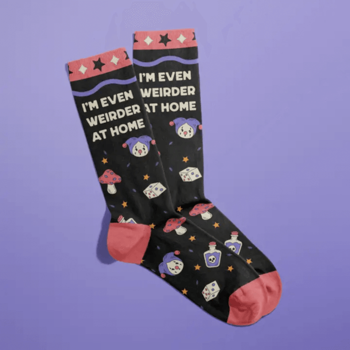 Fun Club funny slogan socks saying I'm Even Weirder At Home with playful icons on black socks