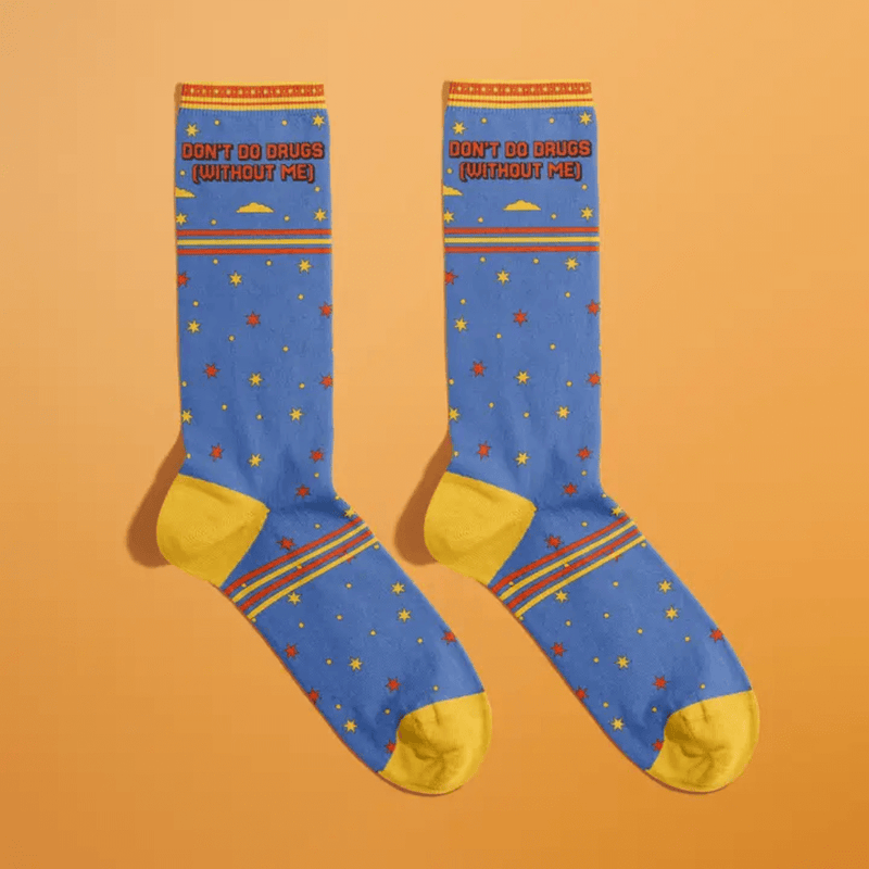 Fun Club novelty socks with Don’t Do Drugs Without Me slogan on blue star print design