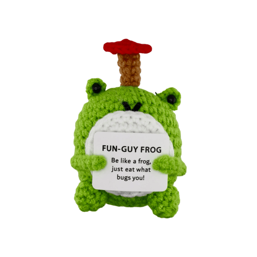 Crochet green frog decoration with mushroom hat holding fun-guy frog message card