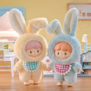 Cheese Bunny in buttery yellow and Sea Salt Bunny in pastel blue standing in café scene	