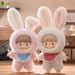Creamy Bunny (white with red gingham bib) and Strawberry Bunny (pink with blue bib) vinyl plush figures	