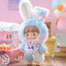 Ultra-rare Macaron Bunny zZoton in pastel blue-pink suit beside sweet-cart backdrop	