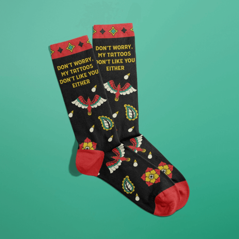 Funny black and red crew socks with bold tattoo art and sarcastic quote for tattoo lovers