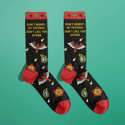 Black women's crew socks with tattoo style eagle and flowers and the phrase Don't Worry My Tattoos Don't Like You Either