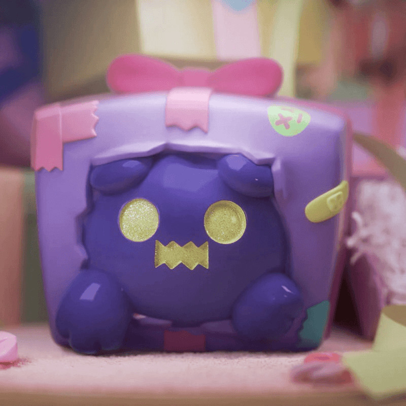 Purple present Ghost Bear figure with gold eyes bursting from gift box—“No Gift For Me?” Blind Box collectable
