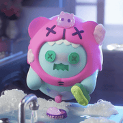 Mint Ghost Bear in pink cat hoodie scrubbing dishes among soap suds and ‘Meow’ bowl.
