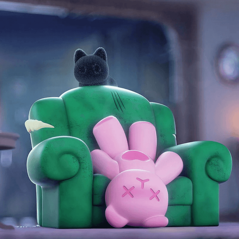 Pink plush Ghost Bear flopped upside-down on battered green armchair while black cat perches.

