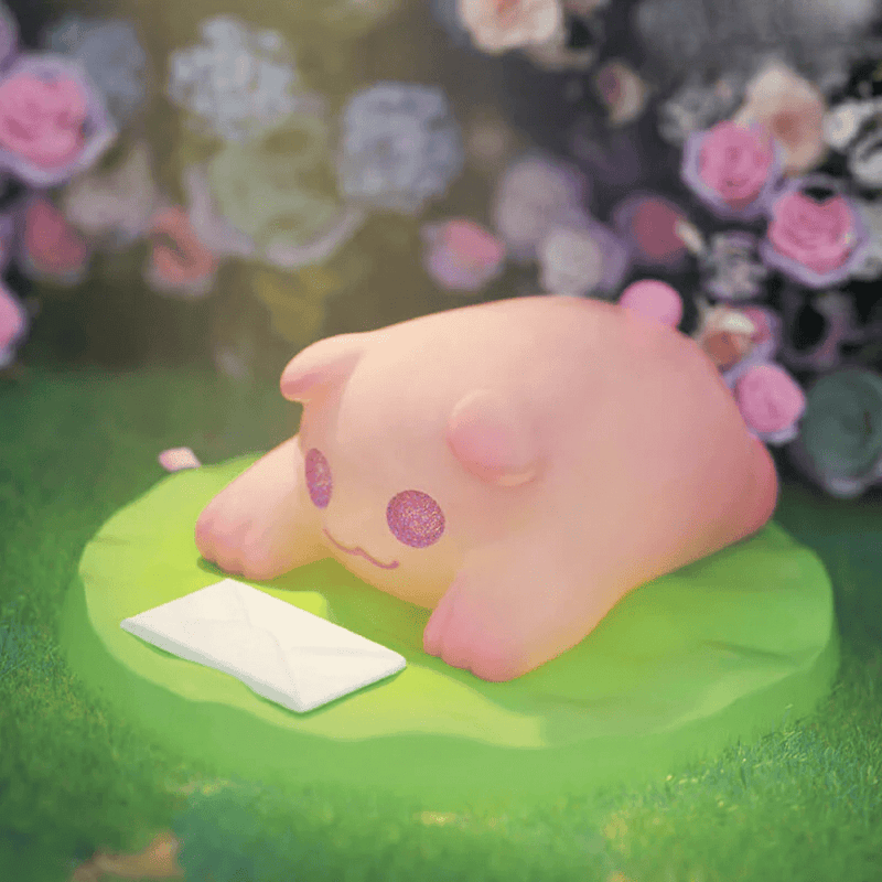 “Secret Letter” Baby Ghost Bear lounging on grass beside a sealed envelope – The Secret Bear Garden blind-box figure
