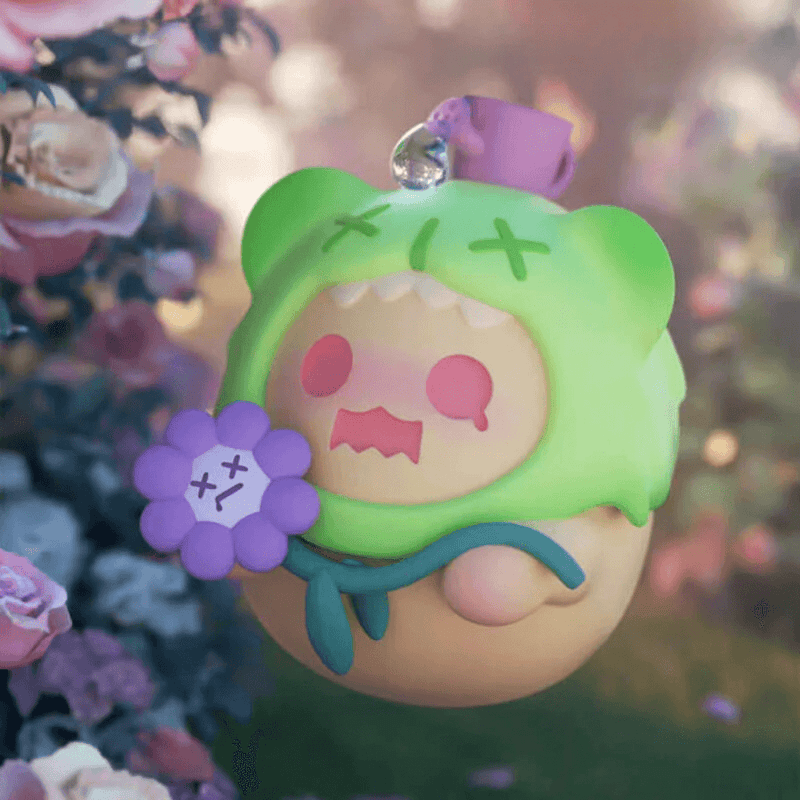 “The Last Moment” Baby Ghost Bear in green hood holding a wilted purple bloom – The Secret Bear Garden collectable

