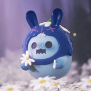 “Wild Flower” Baby Ghost Bear in blue bunny hood clutching a white daisy – The Secret Bear Garden blind-box figure

