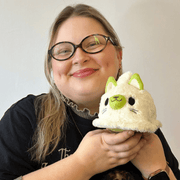 Person holding Squishable Alter Egos Ghost Kitty Plush