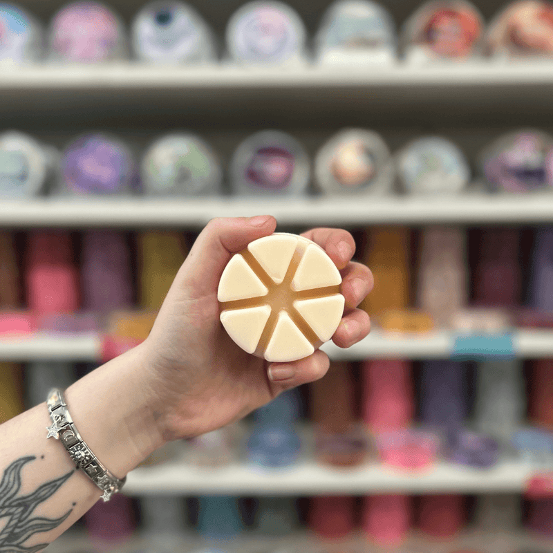 Gin and Tonic cream segmented wax melt held in hand