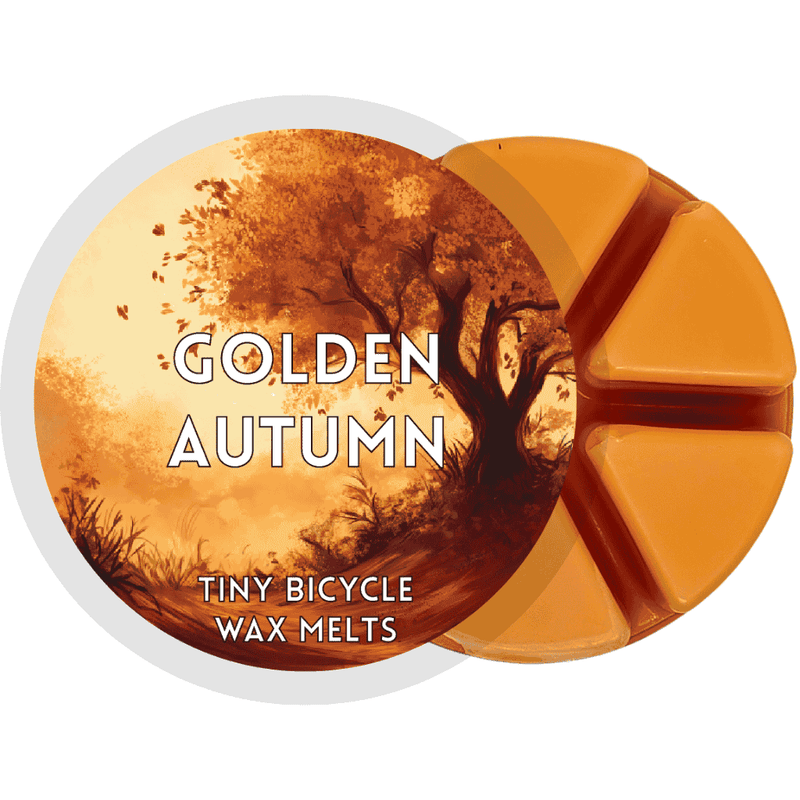 Golden Autumn wax melt with rich orange tones and an illustrated autumn woodland scene.