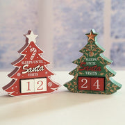 Lifestyle scene of green tree countdown calendar on tabletop alongside matching red version.