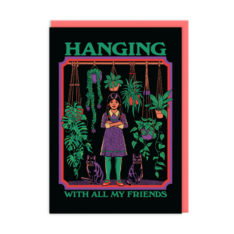 Illustrated greeting card: gothic girl with braids among hanging houseplants, flanked by two black cats on dark background
