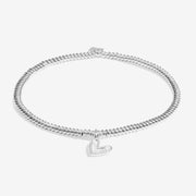 “Silver beaded bracelet with open heart and lab‑grown diamond on white background”
