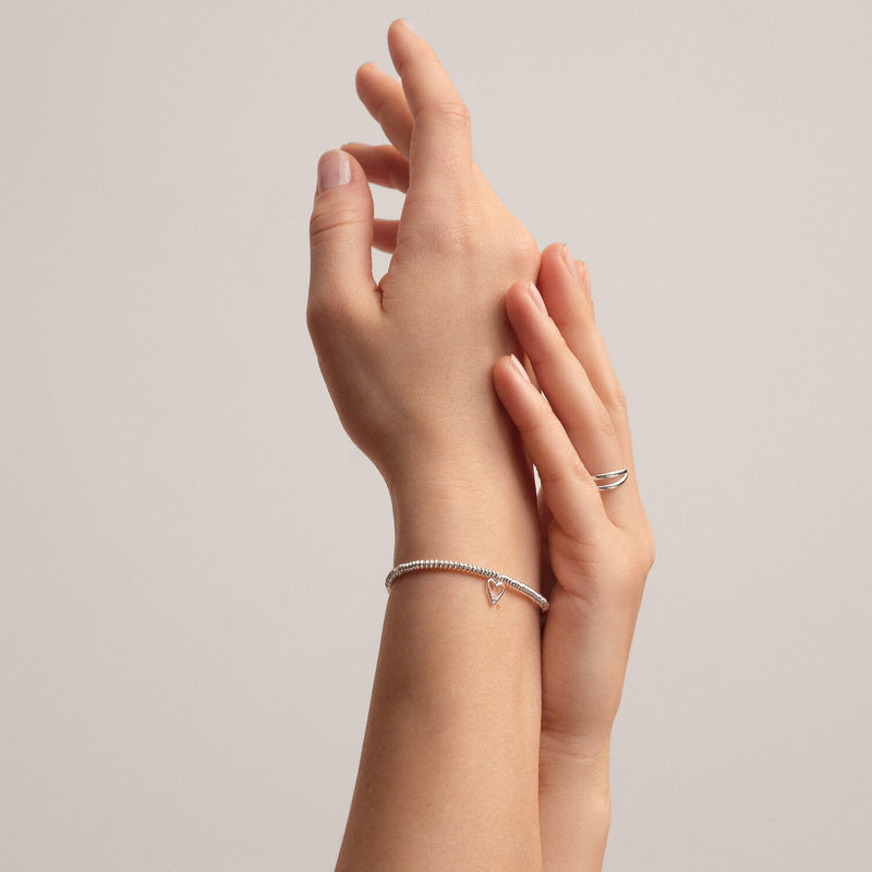 Close view of hands showcasing 40th birthday diamond heart bracelet
