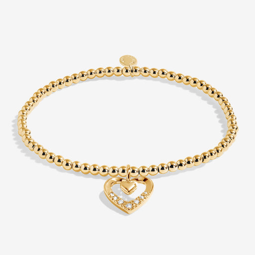 Full view of Joma Jewellery A Little Happy Mother’s Day Bracelet, gold-plated beaded stretch Bracelet with heart charm and crystal detail.