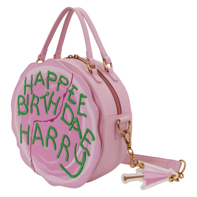 Angled view of Loungefly Happee Birthdae Harry Cake Crossbody Bag with umbrella charm