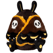 Mini Squishable Hawkmothman plush with skull-patterned wings folded