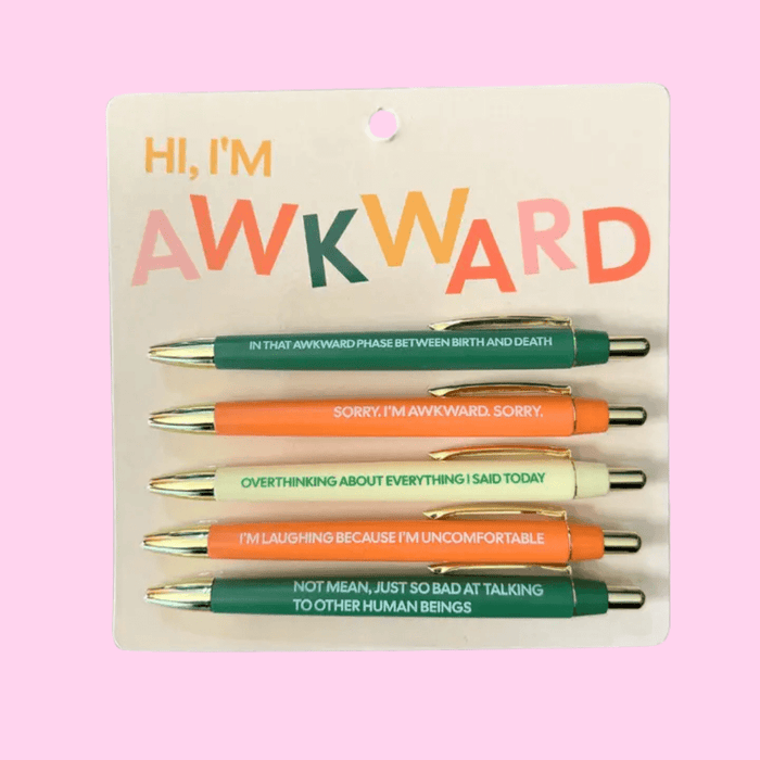 Hi, I’m Awkward pen set on backing card with 5 black-ink ballpoint pens in green, orange and cream, each printed with self-deprecating phrases.
