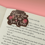 High Lady of the Smut Court magnetic bookmark marking a page in a book