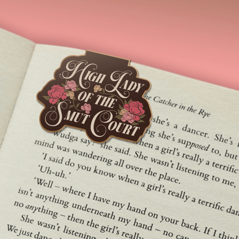 High Lady of the Smut Court magnetic bookmark marking a page in a book