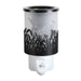 Black plug in wax melt burner unlit with frosted panel and cut-out grass design, showing the Highland cow silhouette in the background.