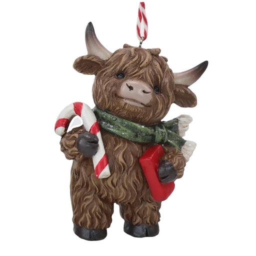 9cm Highland cow ornament holding a candy cane and red gift, green scarf, hanging decoration.

