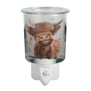 Highland cow glass plug in wax melt burner with a clear glass dish on top and an on/off switch on the plug base.