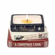 Lit Holiday Classics stacked books Christmas candle with flame above The Nutcracker, 'Twas the Night Before Christmas and A Christmas Carol designs