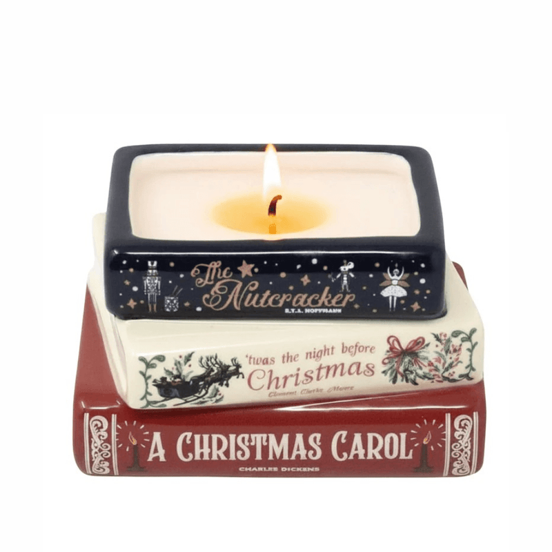 Lit Holiday Classics stacked books Christmas candle with flame above The Nutcracker, 'Twas the Night Before Christmas and A Christmas Carol designs