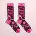 Women’s burgundy crew socks with pink heels, hearts and bedtime icons, text Hot girls are in bed by nine, on pink background.