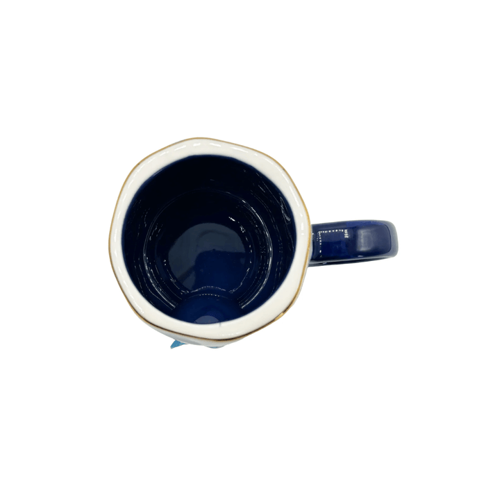 Top view showing the deep blue glazed interior and dark blue handle