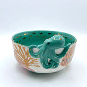 Close-up of the 3D octopus detail clinging to the side of the bowl
