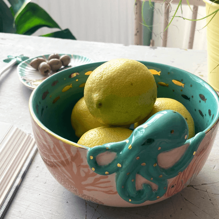 Lifestyle shot of the bowl filled with lemons showing the octopus detail and gold accents