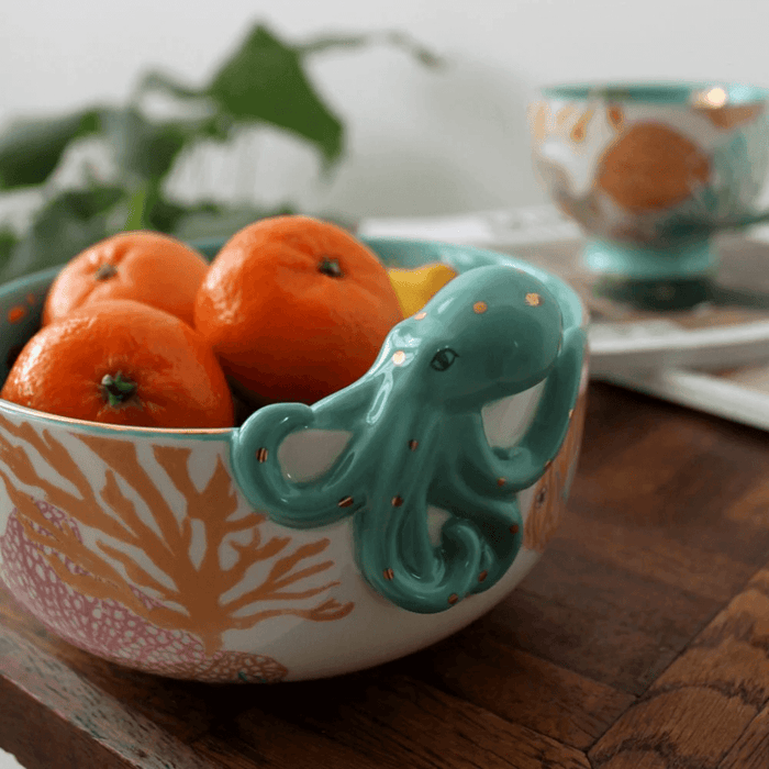 Side view of the porcelain bowl with sea-life illustrations and 3D octopus detail on the rim