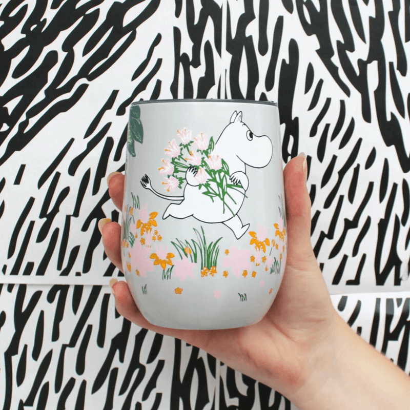 House of Disaster Moomin Floral keep cup held in hand showing Moomin character and pastel floral design