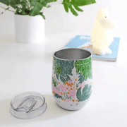House of Disaster Moomin Floral thermal tumbler with lid removed showing the floral wraparound design