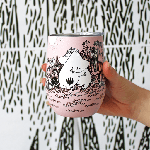 House of Disaster Moomin Love keep cup held in hand showing Moomin and Snorkmaiden hugging on a pink floral design