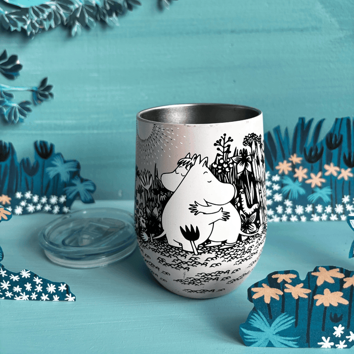 Open House of Disaster Moomin Love keep cup with lid removed in a blue floral display setting