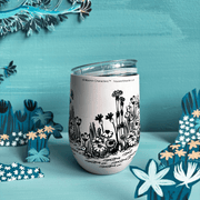 Reverse lifestyle view of House of Disaster Moomin Love keep cup with floral meadow artwork and lid resting on top