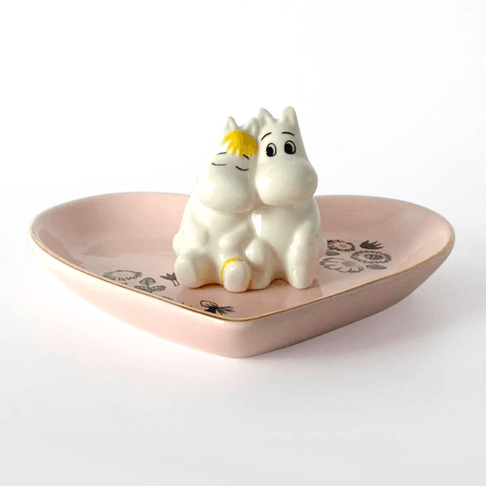 Front view of House of Disaster Moomin Love ring dish with Moomintroll and Snorkmaiden sitting together on a pink heart-shaped dish