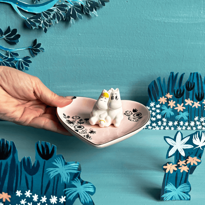 House of Disaster Moomin Love ring dish held in hand showing pink heart tray and 3D Moomin couple figure
