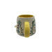 Rear view showing the yellow handle and floral pattern wrapping around the cup