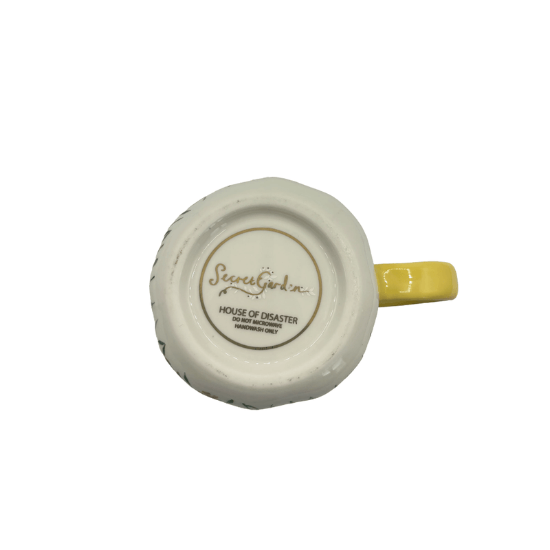 Base of the cup showing Secret Garden branding and handwash-only care details