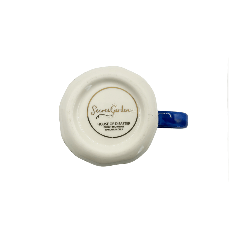 Base of the cup showing Secret Garden branding and handwash-only care details