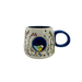 Front view showing the hidden 3D bird sitting inside the blue nook on the cup